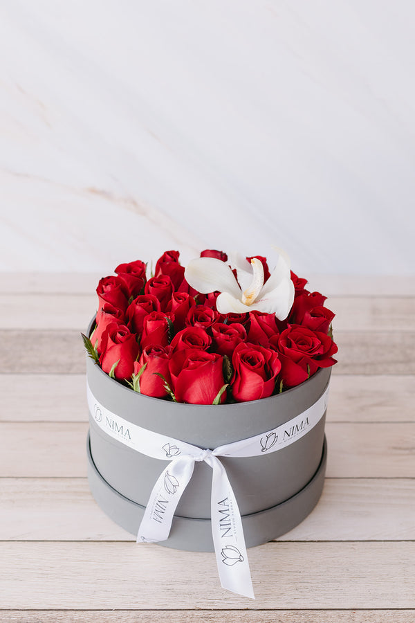 Caja de 30 rosas con Orquídea